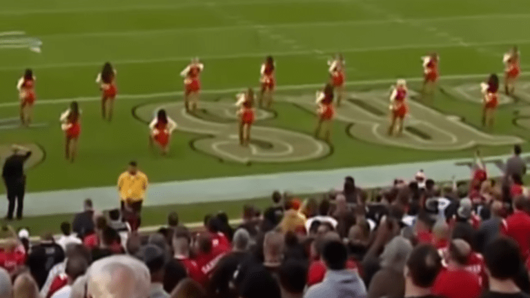 NFL Cheerleader Takes a Knee During National Anthem at Raiders-49ers Game