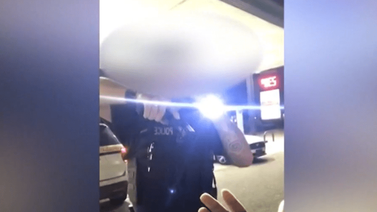 Officer threatens to shoot Black man at gas station while his arms are raised
