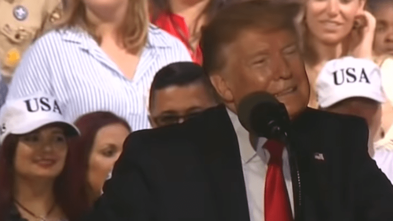 Supporter yells to "shoot" immigrants at rally as Trump laughs on